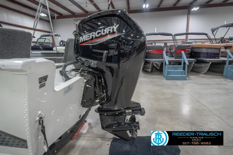 Slide: The Image of 2026 Lund 1675 Adventure Sport with Mercury outboard motor in showroom. - 48