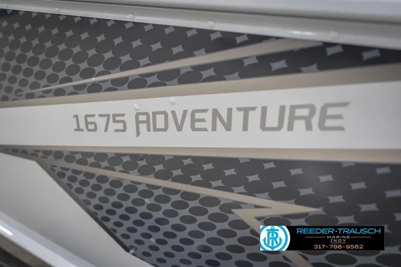 Slide: The Image of 2026 Lund 1675 Adventure Sport boat graphic with geometric design and dealership logo. - 54