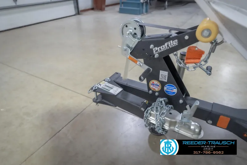 Slide: The Image of Trailer hitch of 2026 Lund 1675 Adventure Sport boat in a showroom. - 56