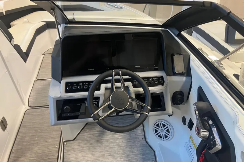 Slide: The Image of 2026 Cobalt R6 boat cockpit with modern steering and control panel. - 12