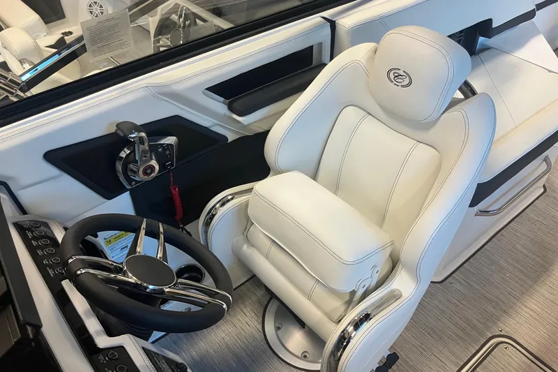 Slide: The Image of Luxury interior of 2026 Cobalt R6 boat featuring a sleek steering wheel and plush captain's chair. - 13