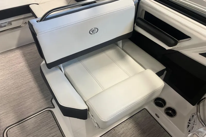 Slide: The Image of 2026 Cobalt R6 boat interior with luxurious white seating and cup holders. - 14