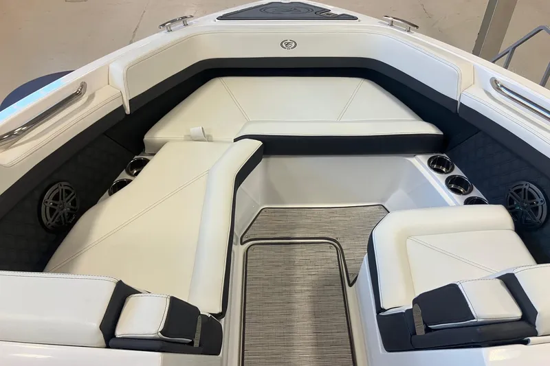 Slide: The Image of 2026 Cobalt R6 boat interior with white seating, cup holders, and speakers. - 17