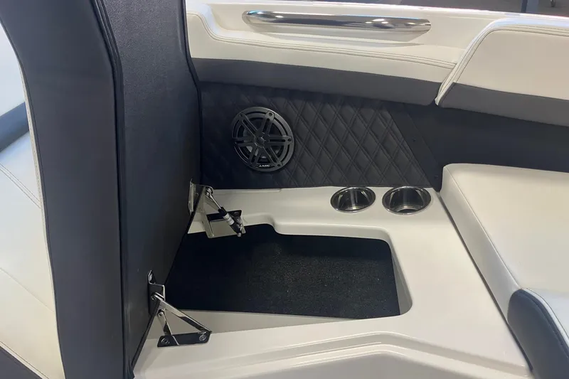 Slide: The Image of 2026 Cobalt R6 interior with speaker, cup holders, and storage compartment. - 21