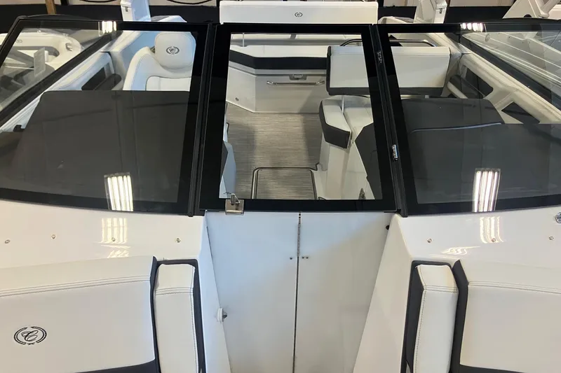 Slide: The Image of 2026 Cobalt R6 boat interior with sleek white seating and modern design. - 23
