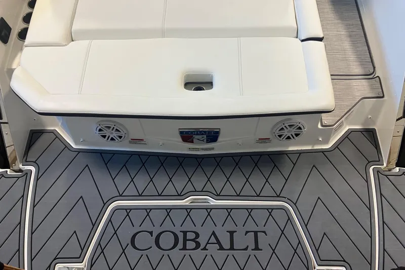 Slide: The Image of 2026 Cobalt R6 boat with white seating and branded flooring. - 3