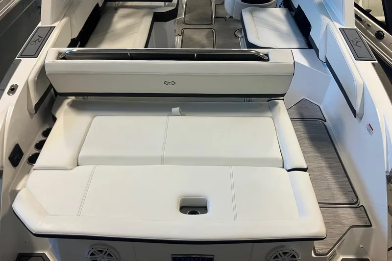 Slide: The Image of 2026 Cobalt R6 boat interior with white cushioned seating and sleek design. - 4