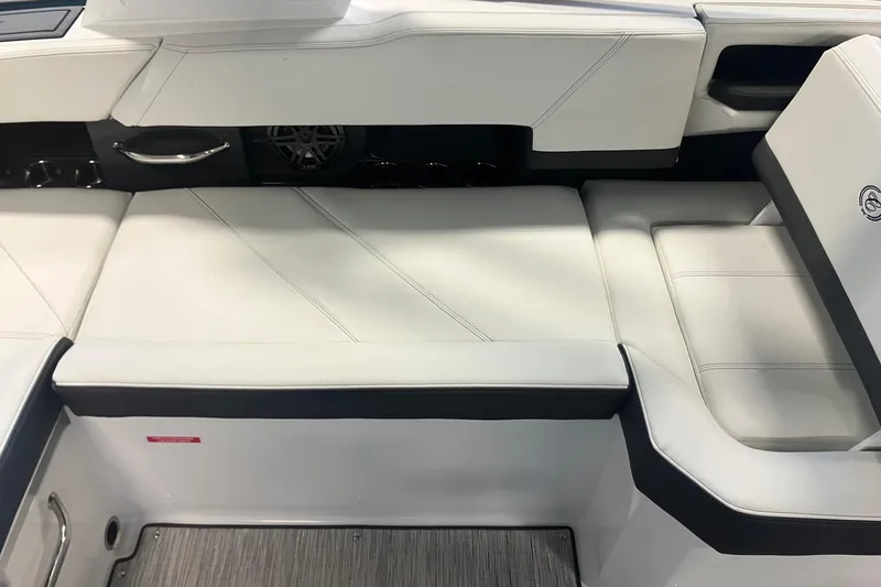 Slide: The Image of 2026 Cobalt R6 boat interior with white cushioned seating and sleek design. - 8