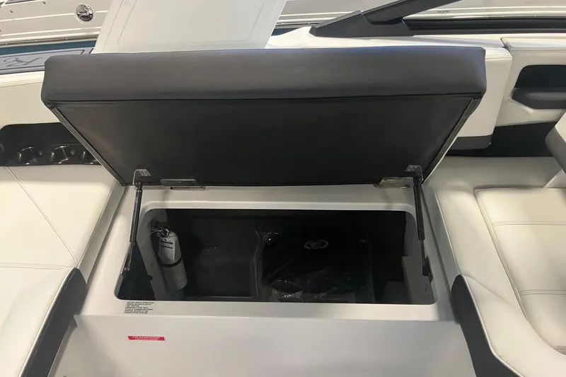 Slide: The Image of Open storage compartment in 2026 Cobalt R6 boat interior. - 9