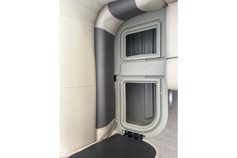Slide: The Image of 2024 Sun Tracker SportFish 22 DLX interior storage compartment, beige and gray upholstery. - 12