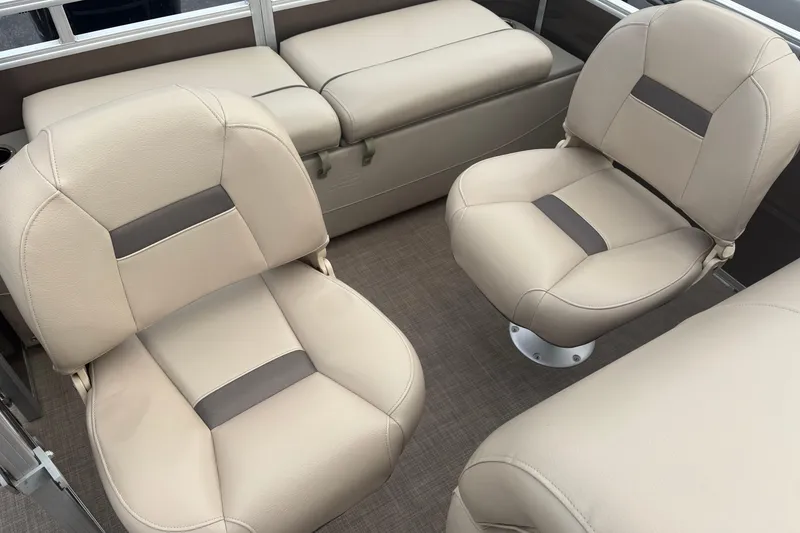Slide: The Image of 2024 Sun Tracker SportFish 22 DLX interior with beige seating and modern design. - 14