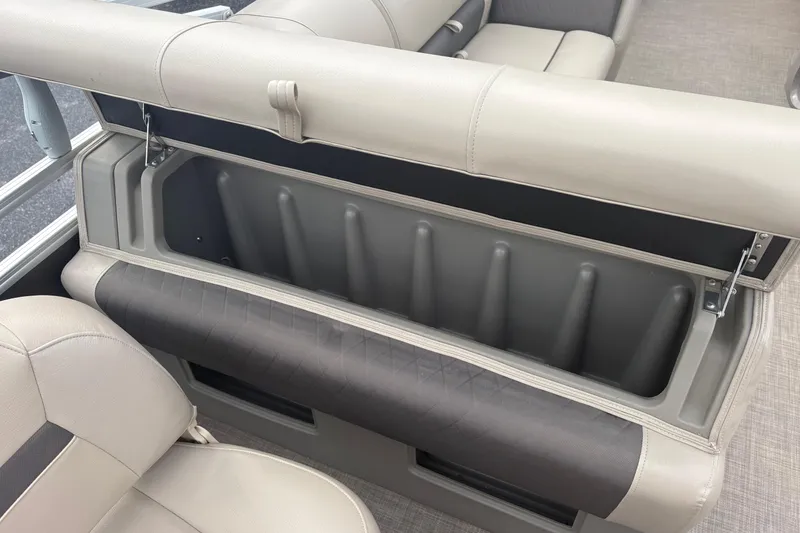 Slide: The Image of 2024 Sun Tracker SportFish 22 DLX boat seat storage compartment, open and spacious. - 15