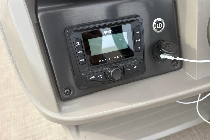 Slide: The Image of 2024 Sun Tracker SportFish 22 DLX audio system with control panel and USB port. - 20