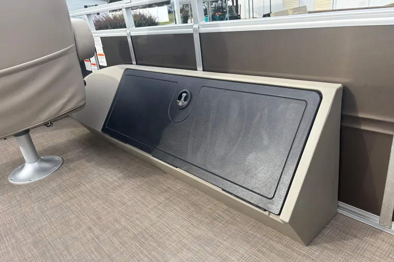 Slide: The Image of 2024 Sun Tracker SportFish 22 DLX boat interior storage compartment and seating. - 24