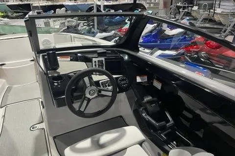 Slide: The Image of 2025 Yamaha Boats SX220 interior with modern dashboard and steering wheel. - 6