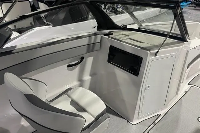 Slide: The Image of 2025 Yamaha Boats SX220 interior with seating and storage compartment. - 7