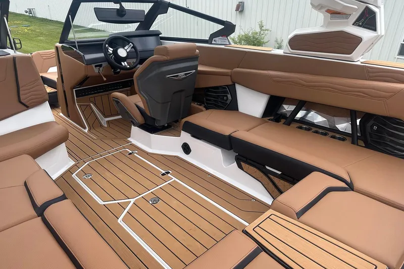 Slide: The Image of 2025 Nautique Super Air Nautique G23 interior with luxurious seating and modern design. - 16