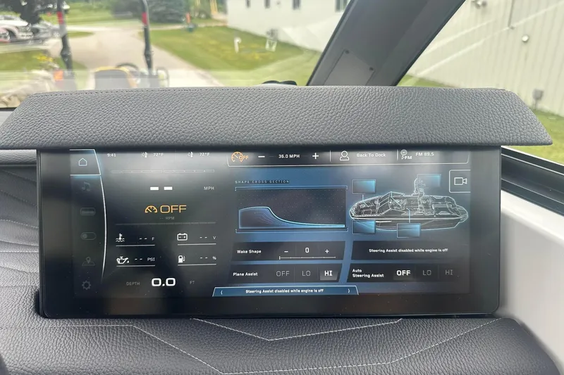 Slide: The Image of Touchscreen display of 2025 Nautique Super Air Nautique G23 boat, showing control settings and navigation. - 32
