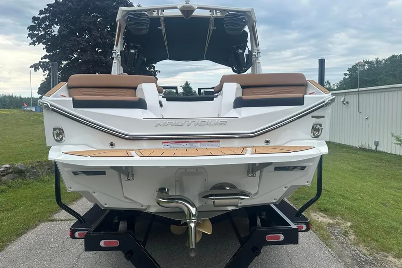 Slide: The Image of 2025 Nautique Super Air Nautique G23 boat rear view on trailer. - 5