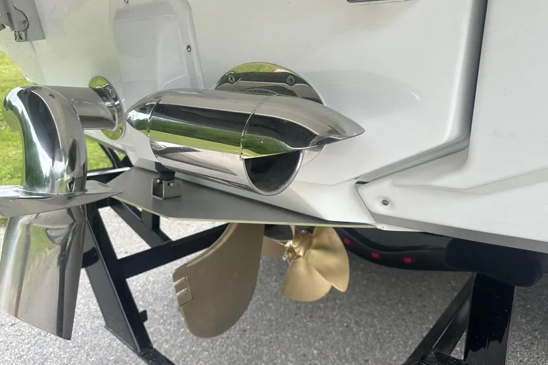 Slide: The Image of 2025 Nautique Super Air Nautique G23 boat exhaust and propeller detail. - 6