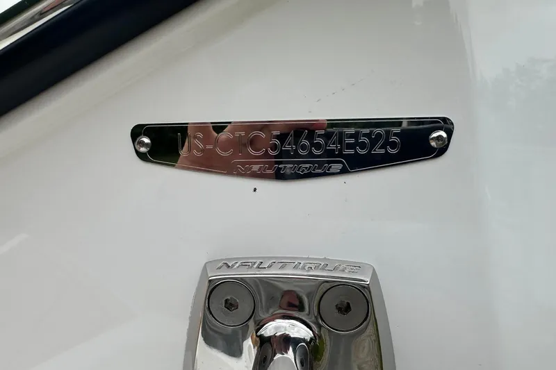 Slide: The Image of 2025 Nautique Super Air Nautique G23 hull identification plate and logo detail. - 8