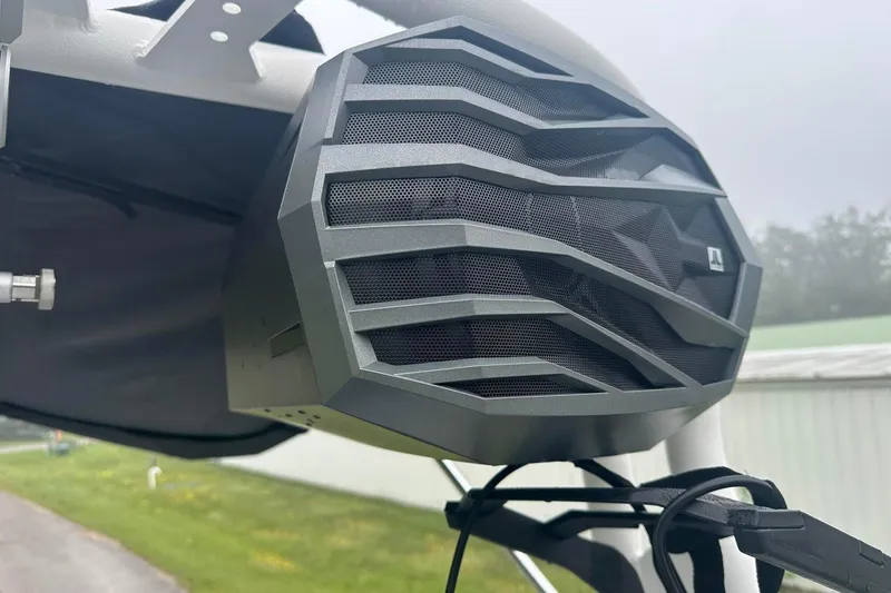 Slide: The Image of Close-up of a speaker on a 2025 Nautique Super Air Nautique GS22 boat. - 20