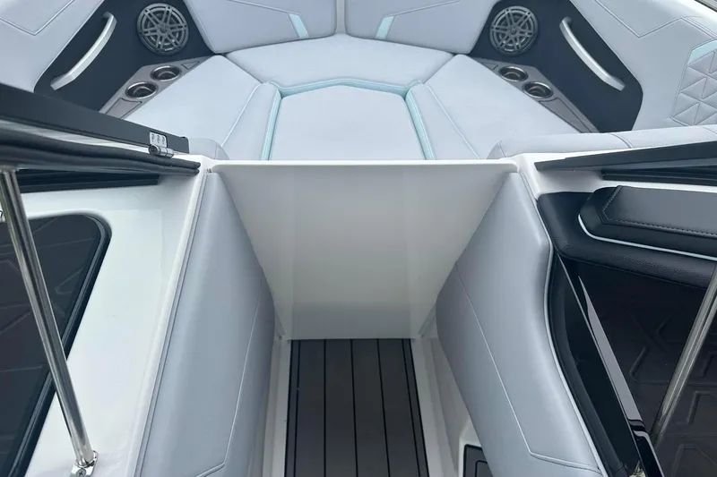 Slide: The Image of 2025 Nautique Super Air Nautique GS22 interior with seating and speaker details. - 24