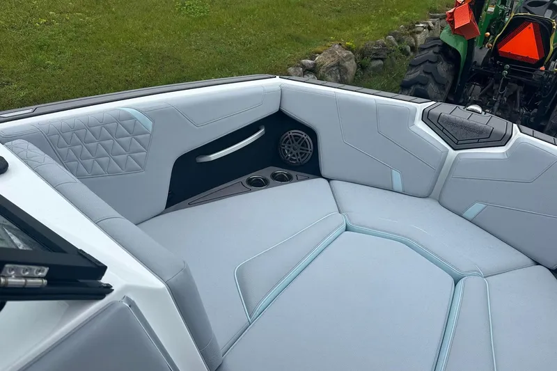 Slide: The Image of 2025 Nautique Super Air Nautique GS22 interior with sleek seating and modern design. - 25