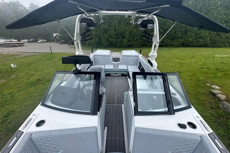 Slide: The Image of 2025 Nautique Super Air Nautique GS22 boat interior with sleek design and spacious seating. - 29