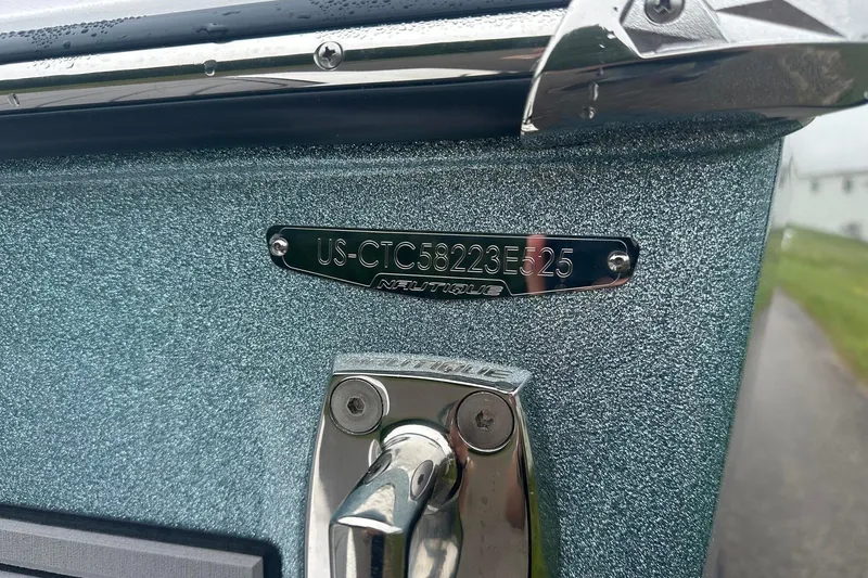 Slide: The Image of 2025 Nautique Super Air Nautique GS22 boat with identification plate and metallic finish. - 9