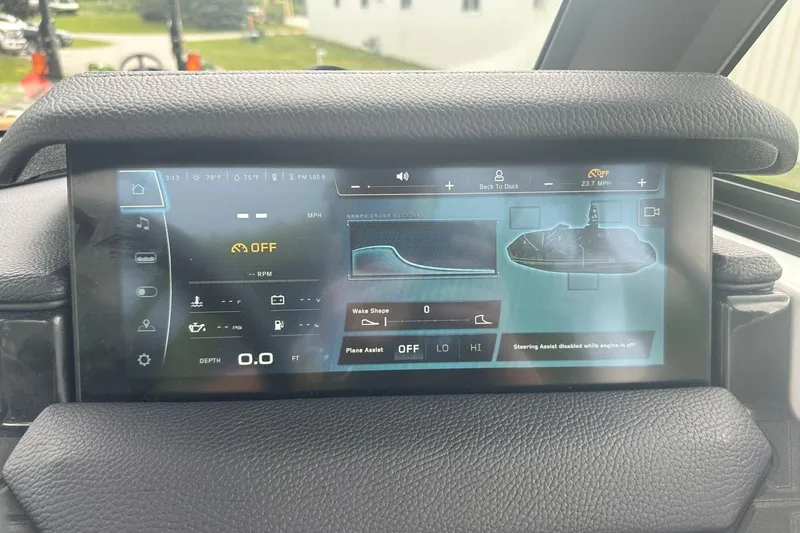 Slide: The Image of 2025 Nautique Super Air Nautique GS22 dashboard display with navigation and control settings. - 12