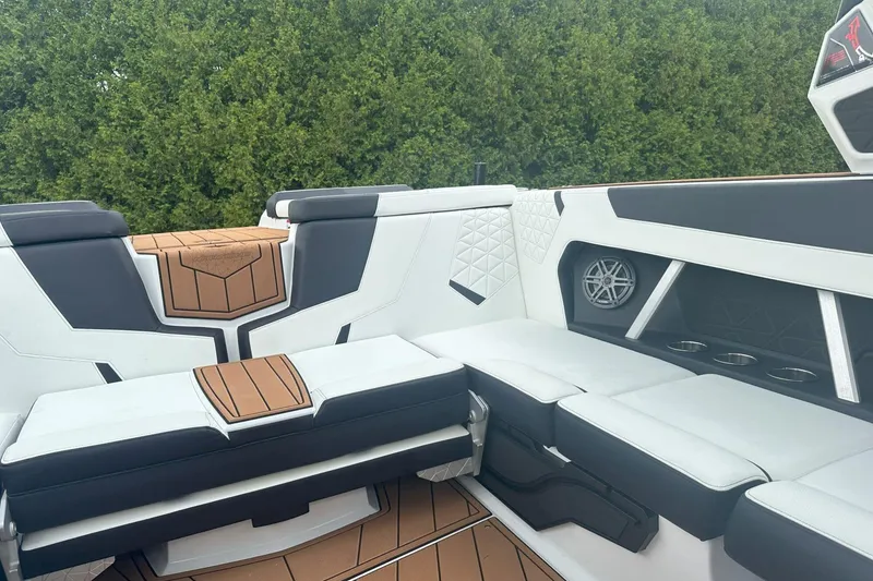 Slide: The Image of 2025 Nautique Super Air Nautique GS22 interior with sleek seating and modern design. - 20