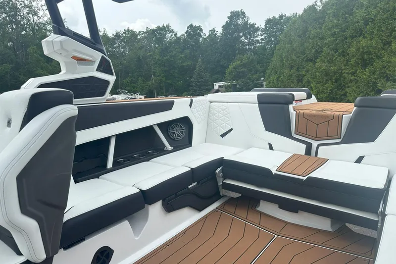 Slide: The Image of 2025 Nautique Super Air Nautique GS22 interior with luxurious seating and modern design. - 21