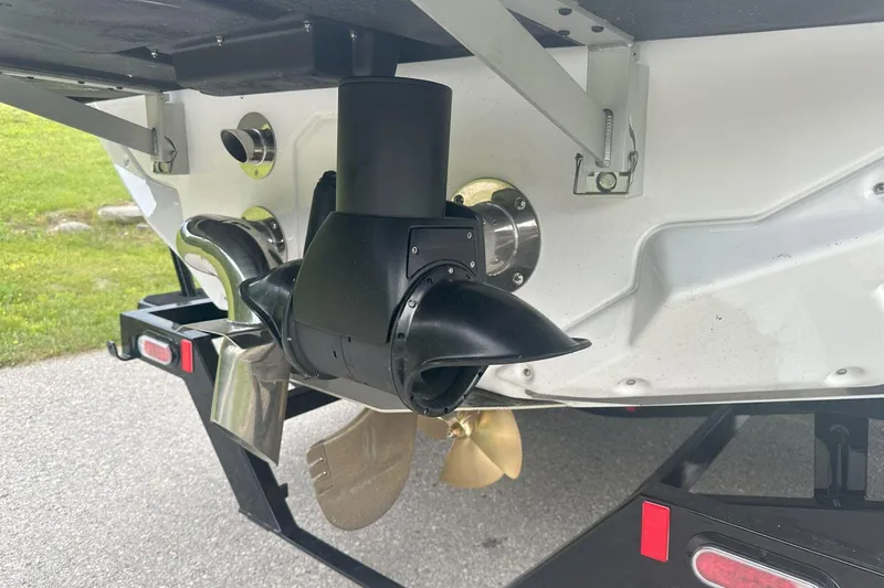 Slide: The Image of 2025 Nautique Super Air Nautique GS22 boat propeller and exhaust system close-up. - 27
