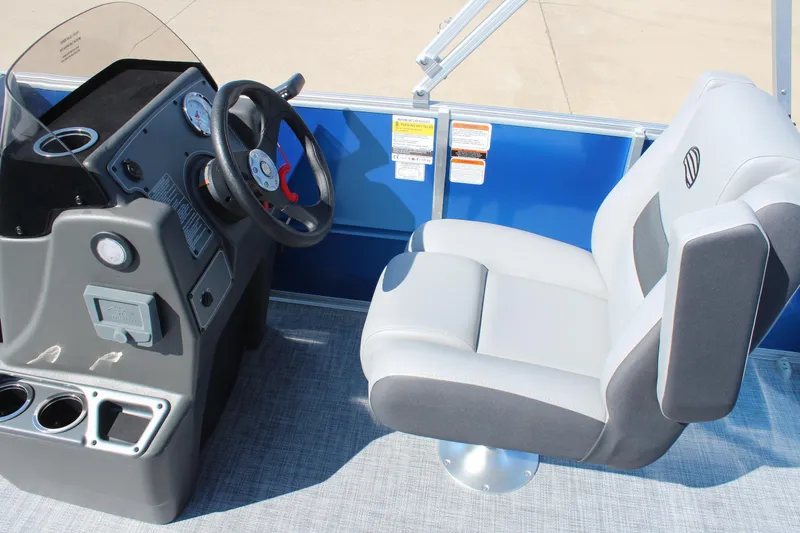 Slide: The Image of 2026 Sun Tracker Party Barge 16 DLX helm with steering wheel and comfortable seating. - 10