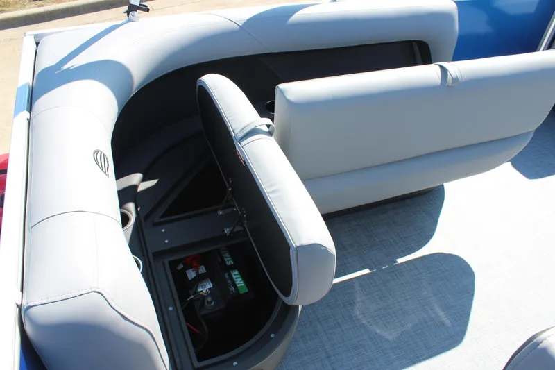 Slide: The Image of 2026 Sun Tracker Party Barge 16 DLX interior with open storage compartment. - 15