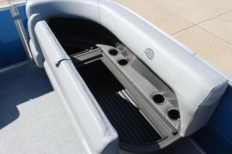 Slide: The Image of 2026 Sun Tracker Party Barge 16 DLX seating with cup holders and storage compartment. - 17