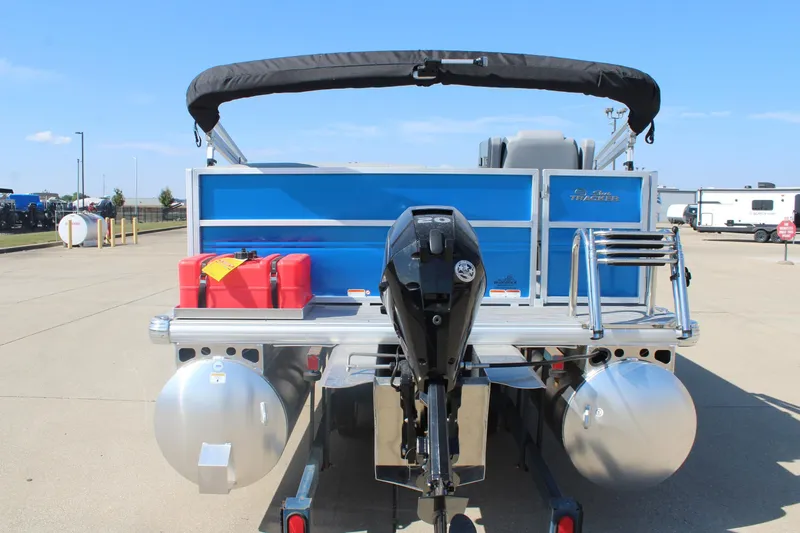 Slide: The Image of 2026 Sun Tracker Party Barge 16 DLX pontoon boat with outboard motor, rear view. - 2