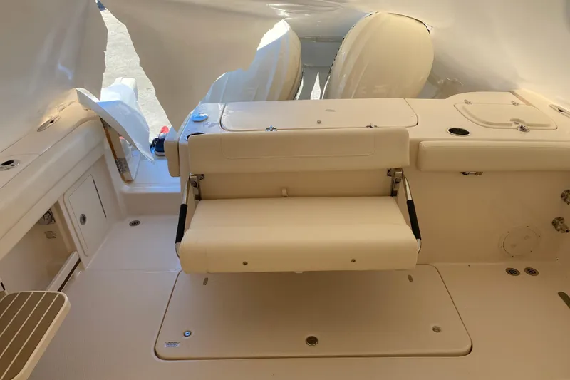 Slide: The Image of 2026 Grady-White Freedom 307 boat interior with seating and storage compartments. - 14