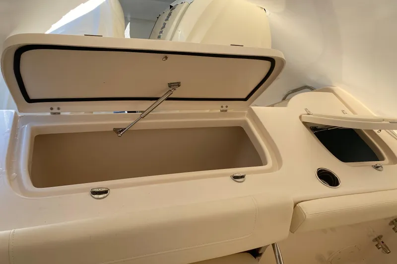 Slide: The Image of Open storage compartments on a 2026 Grady-White Freedom 307 boat. - 15