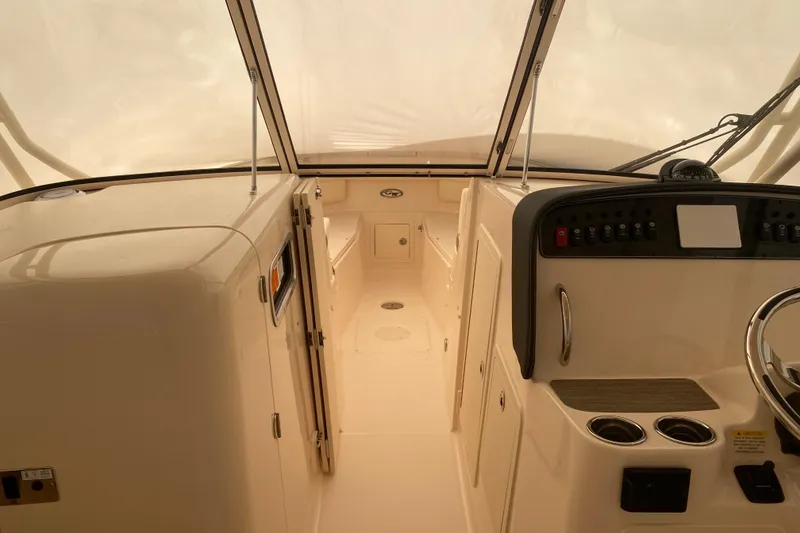 Slide: The Image of 2026 Grady-White Freedom 307 boat interior with helm and seating area. - 4