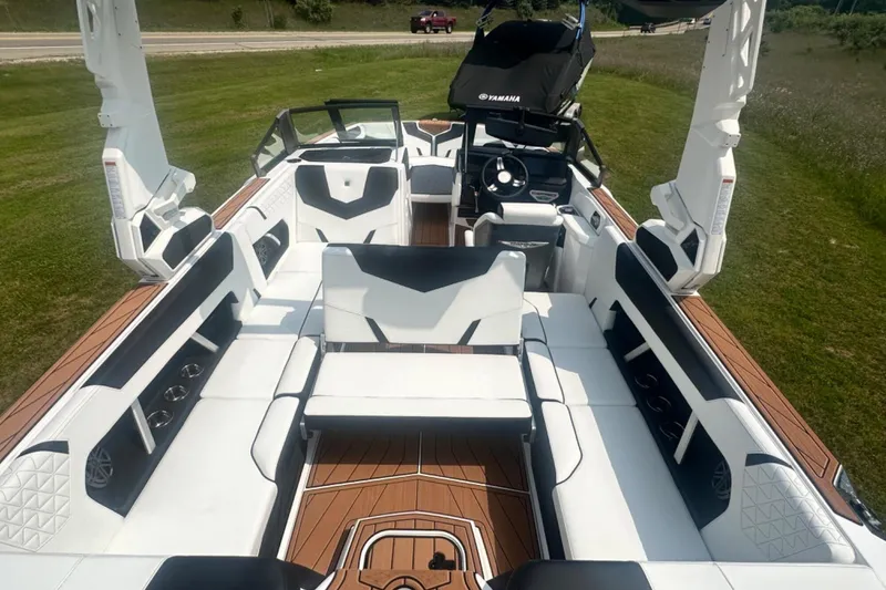 Slide: The Image of 2026 Nautique Super Air Nautique GS22E boat interior with luxurious seating and modern design. - 6