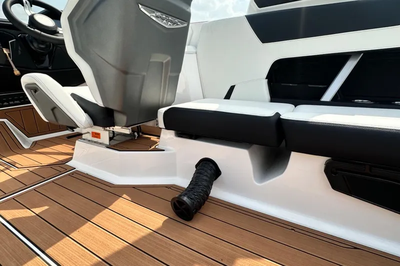 Slide: The Image of 2026 Nautique Super Air Nautique GS22E interior with sleek seating and modern design. - 7