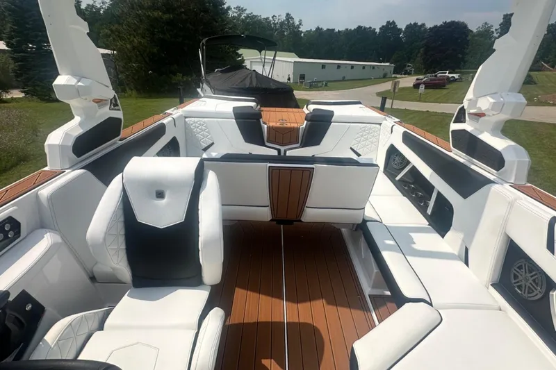 Slide: The Image of 2026 Nautique Super Air Nautique GS22E interior with luxurious seating and modern design. - 9