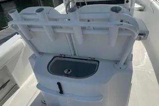 Slide: The Image of 2014 Sea Hunt Gamefish 25 boat with rod holders and storage compartment. - 6