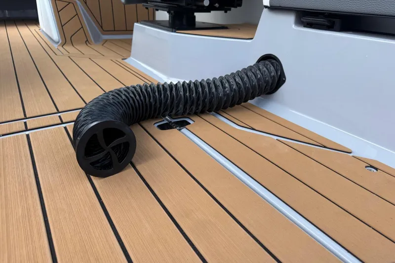 Slide: The Image of 2026 Nautique Super Air Nautique G25 deck with flexible hose detail. - 14