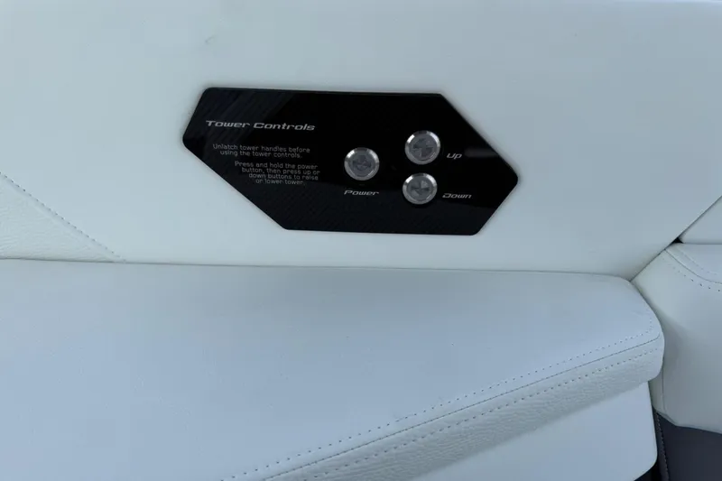 Slide: The Image of 2026 Nautique Super Air Nautique G25 tower controls on white interior panel. - 15