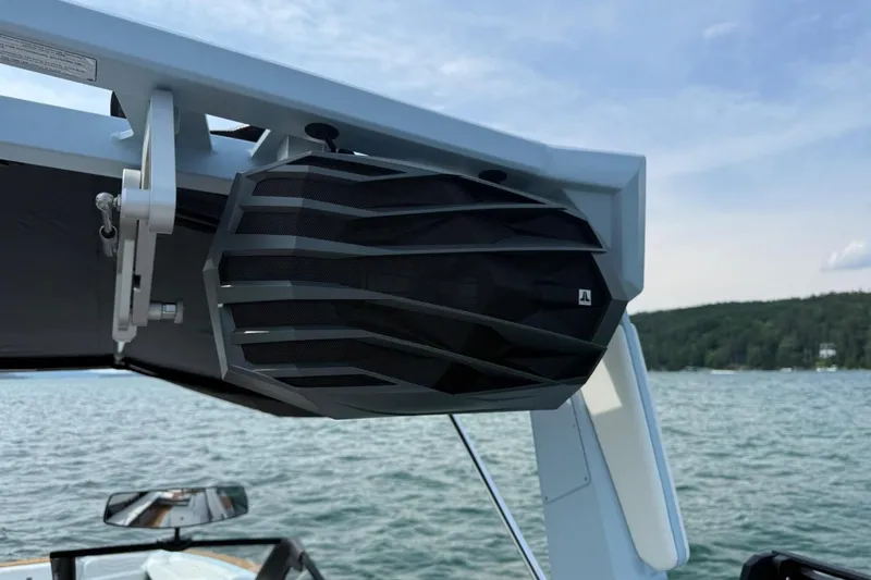 Slide: The Image of 2026 Nautique Super Air Nautique G25 boat speaker on a lake. - 17