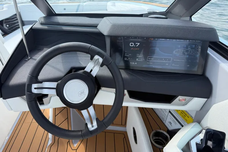Slide: The Image of 2026 Nautique Super Air Nautique G25 dashboard with steering wheel and digital display. - 9