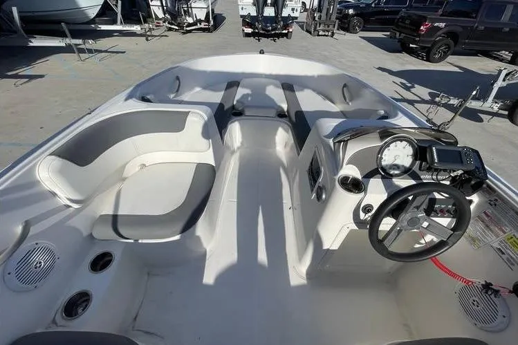 Slide: The Image of 2017 Bayliner Element E16 boat interior with seating and steering console. - 11